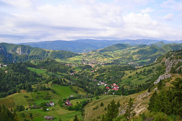 Fototapeta na wymiar View of the Carpathians with village, Romania