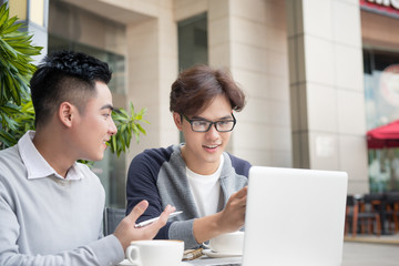 Asian Business people with casual suit working in coffee shop