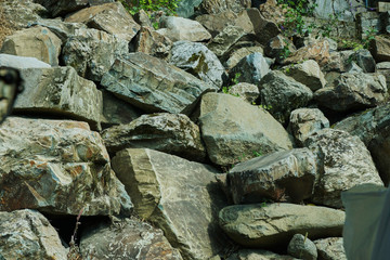 Texture " Natural stone "/Beautiful texture of natural stones stacked in tiers. The color of the stones is different, mostly shades of brown. The texture is a natural stone