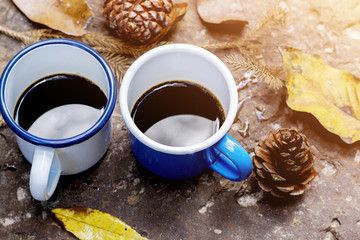 Blue and white cups of coffee on ground