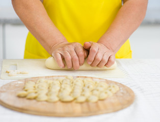 Close-up of woman's hand kneading dough