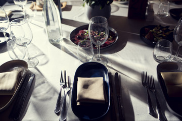 service with silverware and glass stemware for an event party