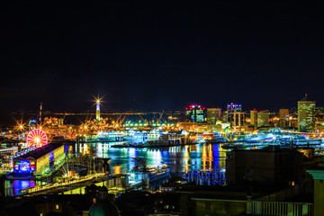 Fototapeta premium GENOA, (GENOVA), ITALY, NOVEMBER 27, 2017 - Night view of the ancient harbor, City of Genoa, Italy/ Genoa landscape/ Genoa Skyline