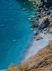 Fototapeta na wymiar Secluded nudist beach in Astypalaia island in Greece