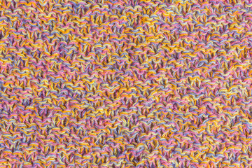 background of multicolored knitted fabric close-up