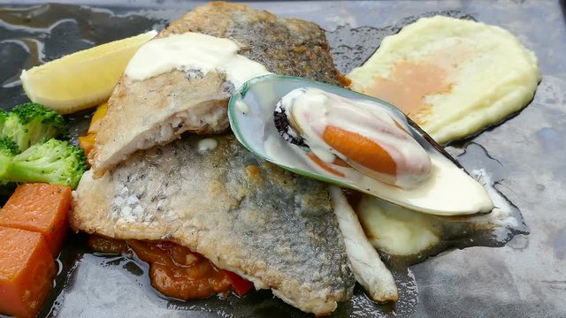 Sea bass steak with sauce
