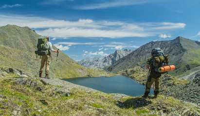 Fototapeta na wymiar Men hiking in mountains. Siberia.