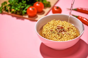 Cooking instant noodles, boiling water.