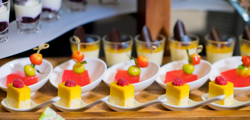 Glass shots  pastry. wedding catering food. mini canapes food.  tasty dessert. Beautiful decorate catering banquet table.  snacks and appetizers. wedding celebration