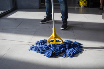 The man mop floor.