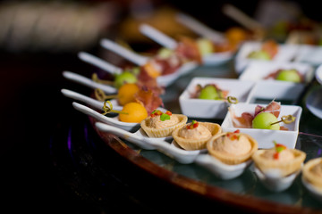 Glass shots  pastry. wedding catering food. mini canapes food.  tasty dessert. Beautiful decorate catering banquet table.  snacks and appetizers. wedding celebration