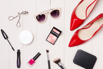 Top view of cosmetics and female accessories. Woman Essentials.