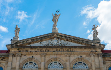 View of the gable roof of National Theater in Costa Rica downtown square with angle, beautiful blue sky and copy space for text.