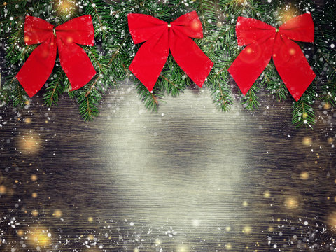 christmas decoration and snow on wooden background