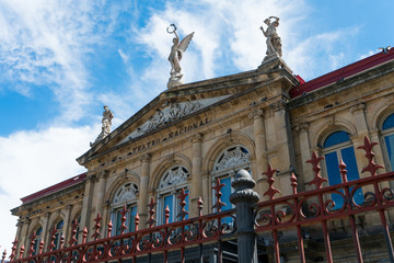 View of the gable roof of National Theater in Costa Rica downtown square with angle, beautiful blue...