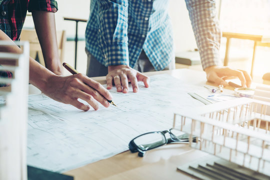 Engineer meeting for architectural project and working with partner engineering on workplace