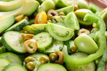 Delicious vegetable salad with cucumber and tomato, closeup