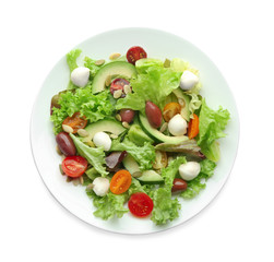 Plate with delicious vegetable salad on white background, top view