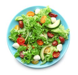 Plate with delicious vegetable salad on white background, top view