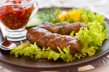 sausage grilled with herbs and sauce