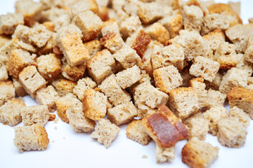 piece of brown bread biscuit on a white background