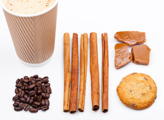 Coffee cup with beans cinnamon caramel and cookie