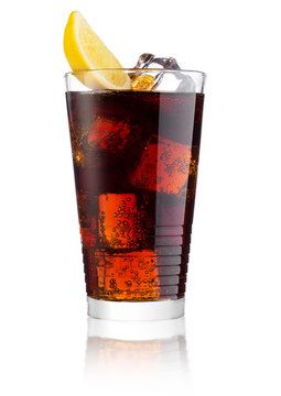 Glass of cold cola soda drink with lime and lemon