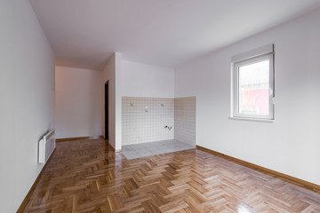 Empty room with walls and wooden floor