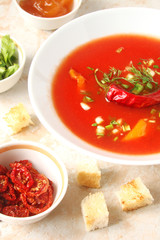 tomato soup with chilli peppers, sweet peppers, garlic, herbs and spices with toast