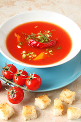 tomato soup with chilli peppers, sweet peppers, garlic, herbs and spices with toast