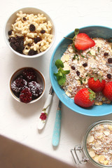 Cereal with grapes and strawberries, dried fruit, honey
