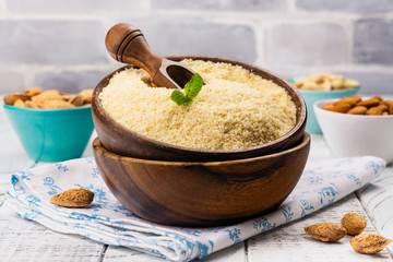 Almond flour in a wooden bowl
