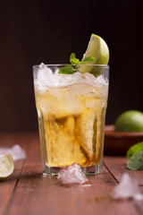 Fresh cocktail prepared with ginger beer, lime and ice