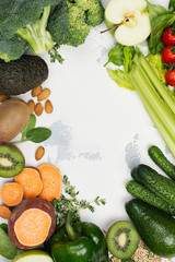 Green fruits and vegetables on white background