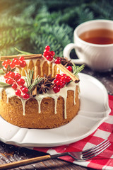 Homemade Christmas or New Year holiday berry cake decorated currants and rosemary. Concept of festive desserts