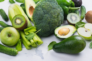 Green fruits and vegetables on white background