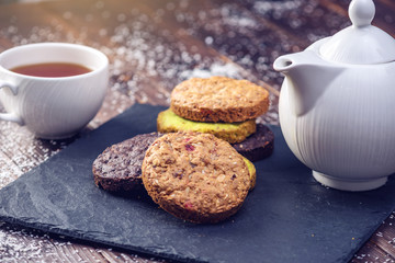 Homemade Christmas or New Year holiday oatmeal cookies with pistachios and chocolate. Concept of festive desserts