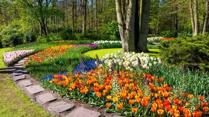 Spring Formal Garden. Beautiful garden of colorful flowers - obrazy, fototapety, plakaty