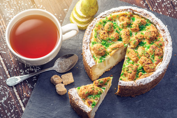 Homemade Christmas or New Year holiday pear pie decorated in a rustic style. Concept of festive desserts