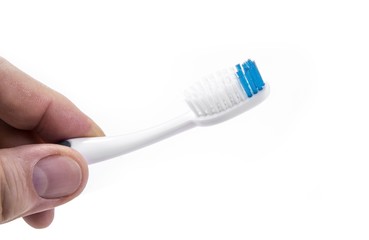 Toothbrush in the hand for teeht cleaning.