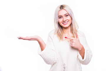 Woman holding her hand out while pointing at it in white background