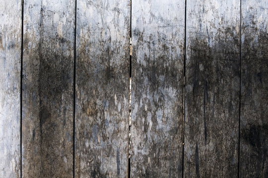 Rough grungy grey wooden floor photo background. Rustic wood plank closeup.