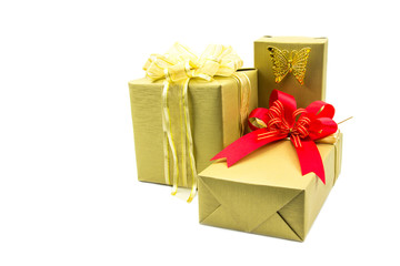 Gold gift box and ribbon red isolated on white background