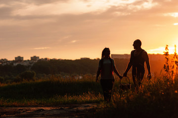 Naklejka na ściany i meble Couple walk informal meadow picnic love concept. Hiker lifestyle. Together on the nature.