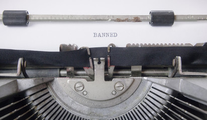 Typing the word Banned - with an old vintage typewriter.
