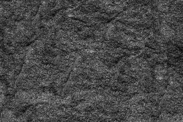 high gray mountain with a flat slope covered with greenery in orange yellow light dawn of the sun