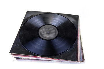 Black vinyl record on the white background