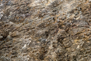texture stone wall canvas part of rock uneven weathered background beige brown