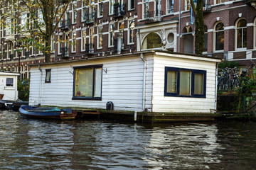 Traditional Floating boat house in Amsterdam canals, the Netherlands, October 13, 2017