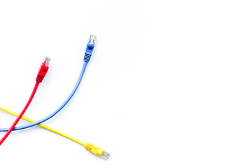 Colored patch-cord on white background top view copyspace